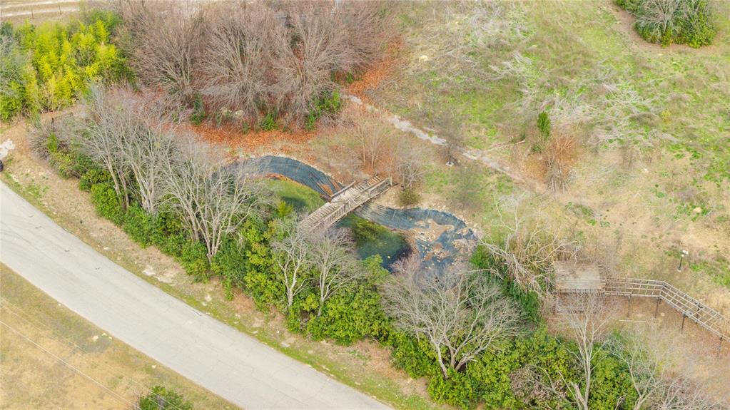 380 Dublin Road Parker, TX 75094 - Photo 12 of 25 a view of a garden with plants and a bench