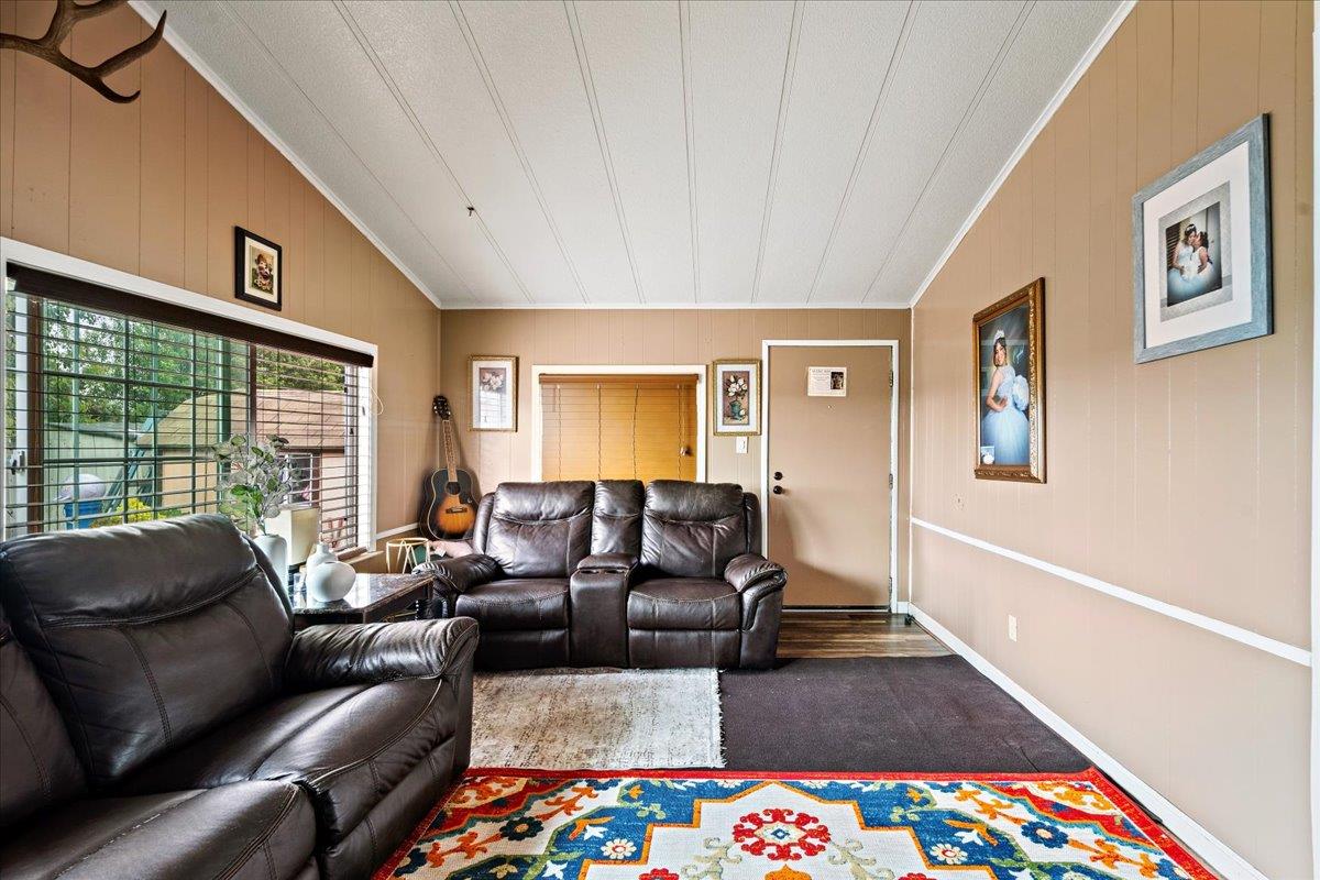 13607 Monte Del Sol, Unit 127 Castroville, CA 95012 - Photo 14 of 27 a living room with furniture and a rug