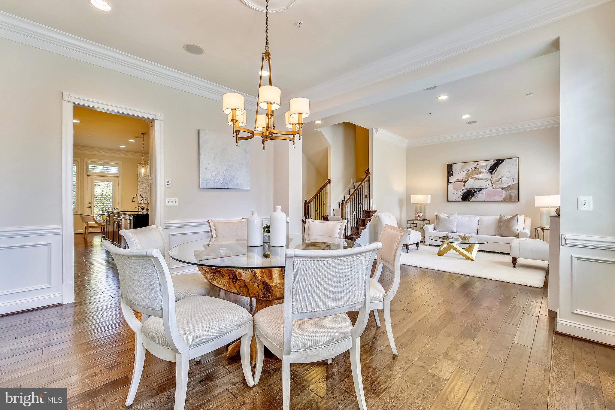 1411 Ridgeview Way Washington, DC 20007 - Photo 11 of 43 a view of a dining room with furniture wooden floor and chandelier