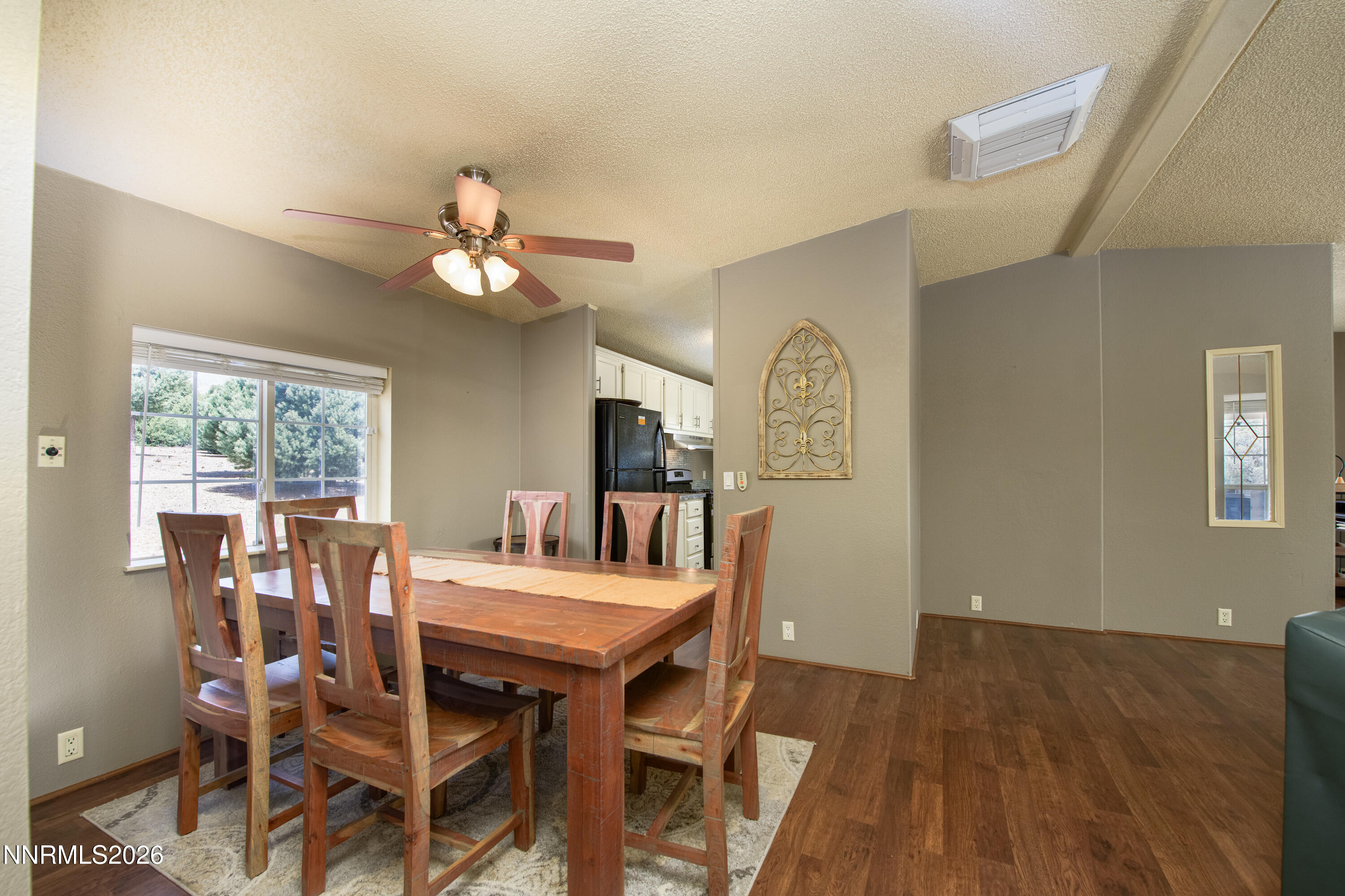 1355 Sandstone Drive Topaz Ranch Estates, NV 89444 - Photo 16 of 57 a view of a dining room with furniture window and wooden floor