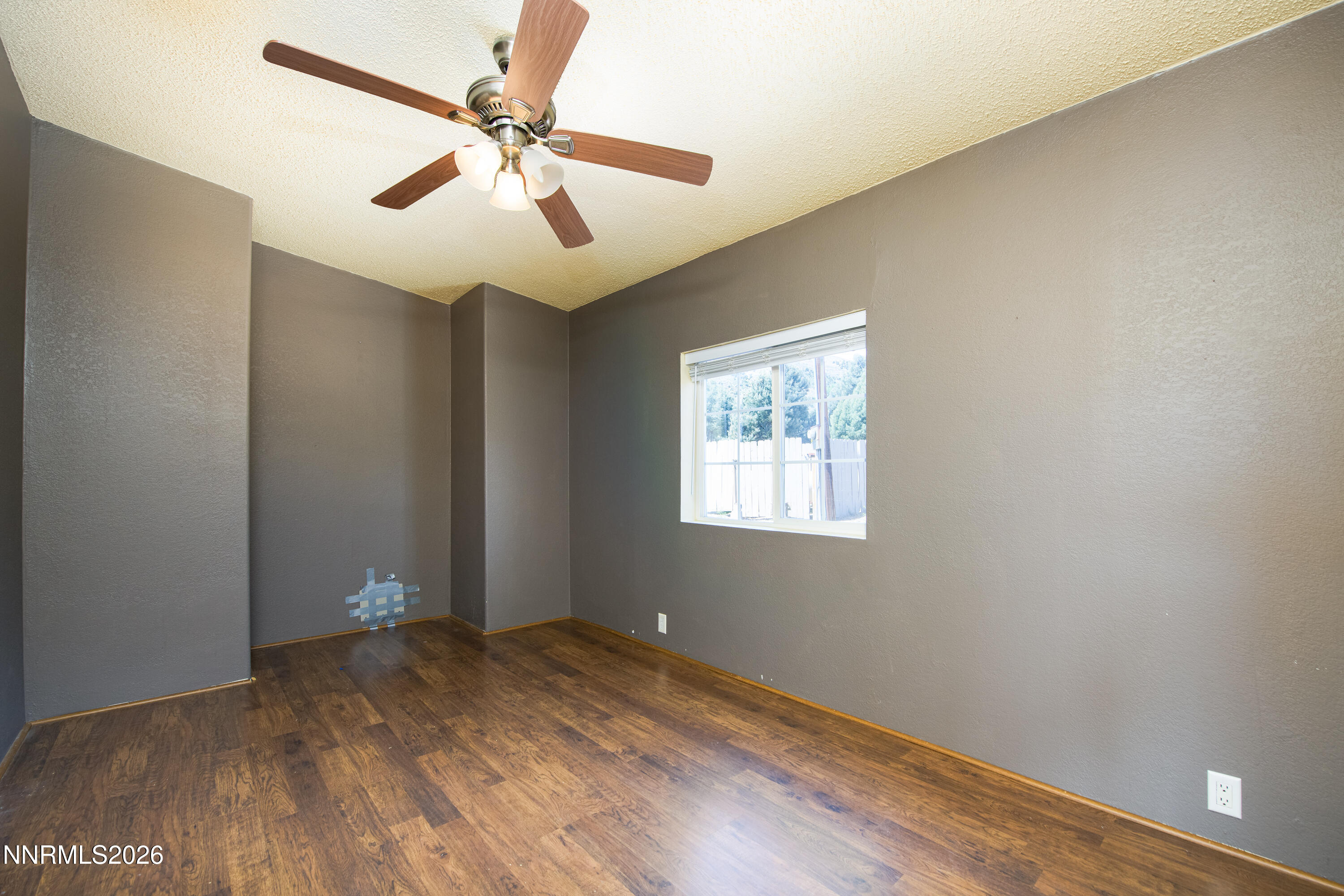 1355 Sandstone Drive Topaz Ranch Estates, NV 89444 - Photo 17 of 57 wooden floor in an empty room with a window