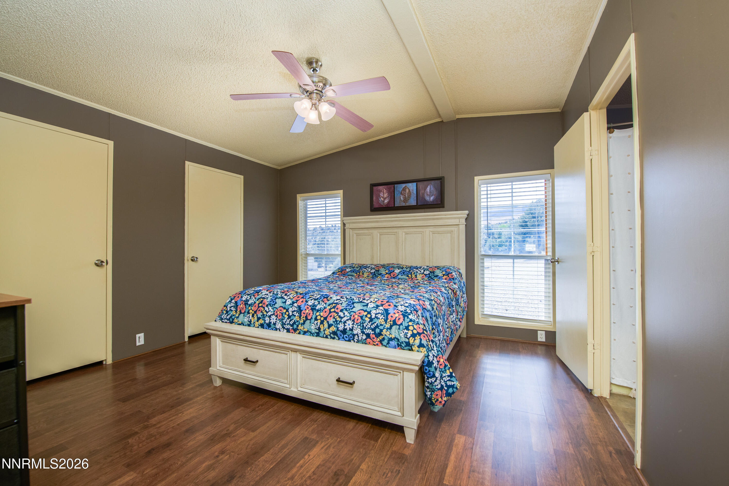 1355 Sandstone Drive Topaz Ranch Estates, NV 89444 - Photo 22 of 57 a bedroom with a bed and a chandelier