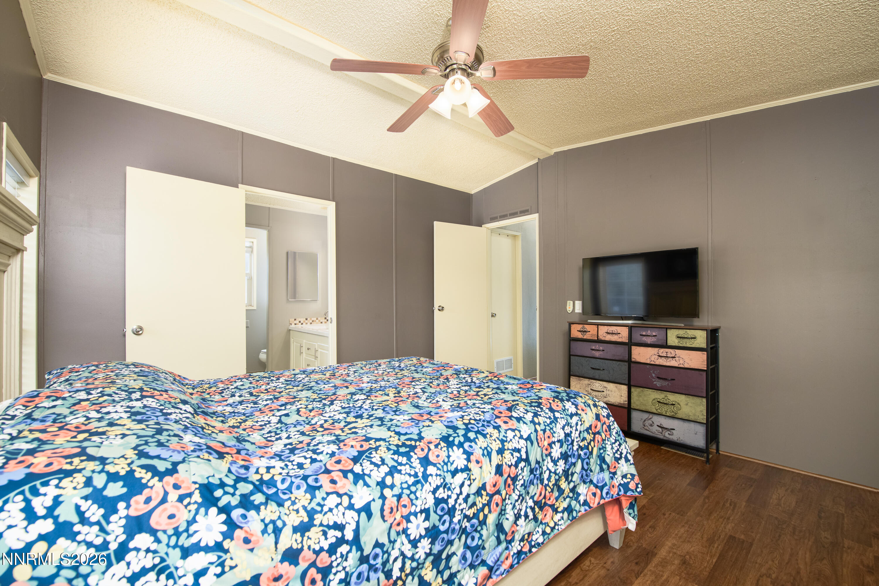 1355 Sandstone Drive Topaz Ranch Estates, NV 89444 - Photo 23 of 57 a bedroom with a bed and a flat screen tv