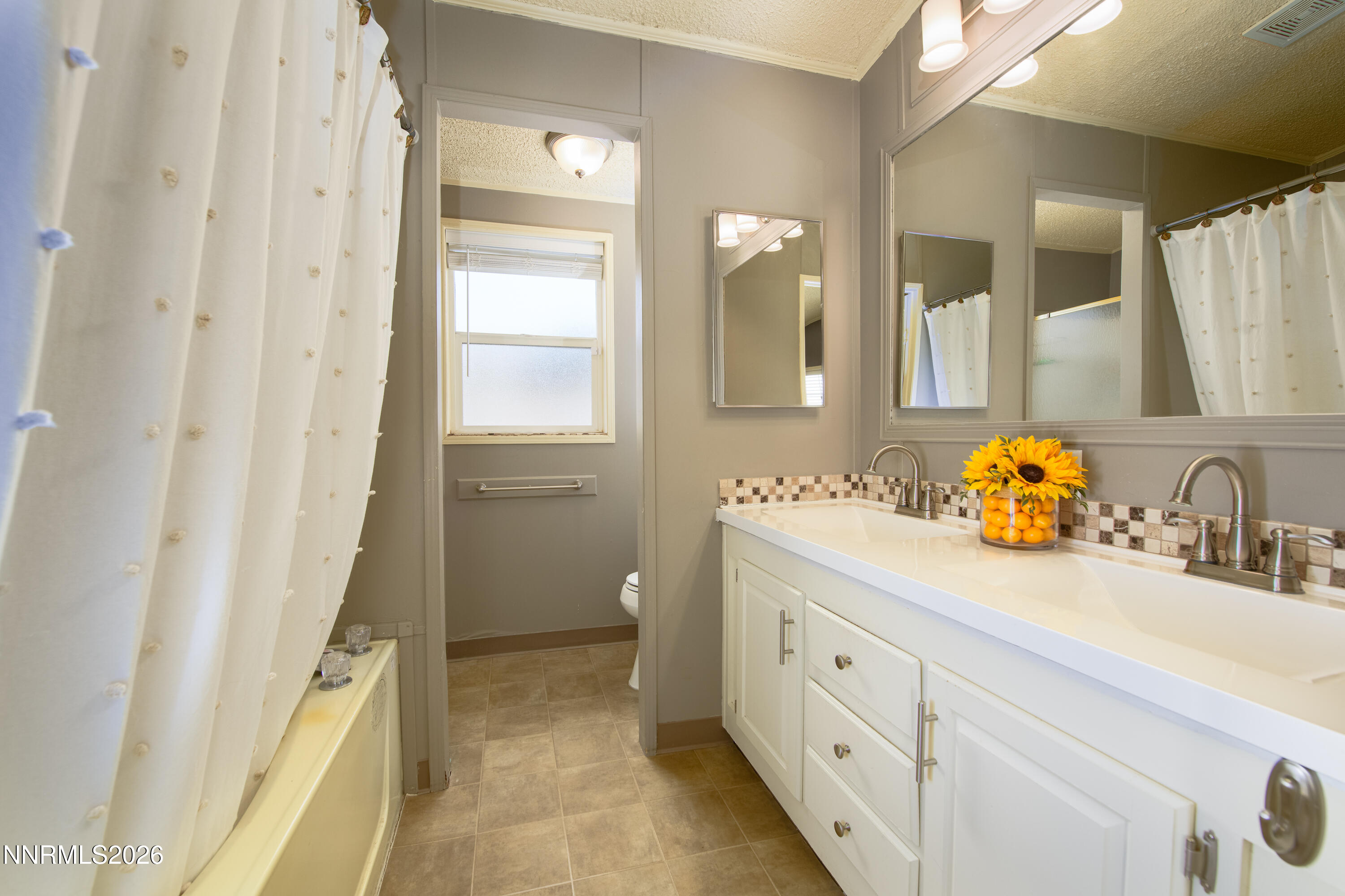 1355 Sandstone Drive Topaz Ranch Estates, NV 89444 - Photo 24 of 57 a bathroom with a double vanity sink and a mirror