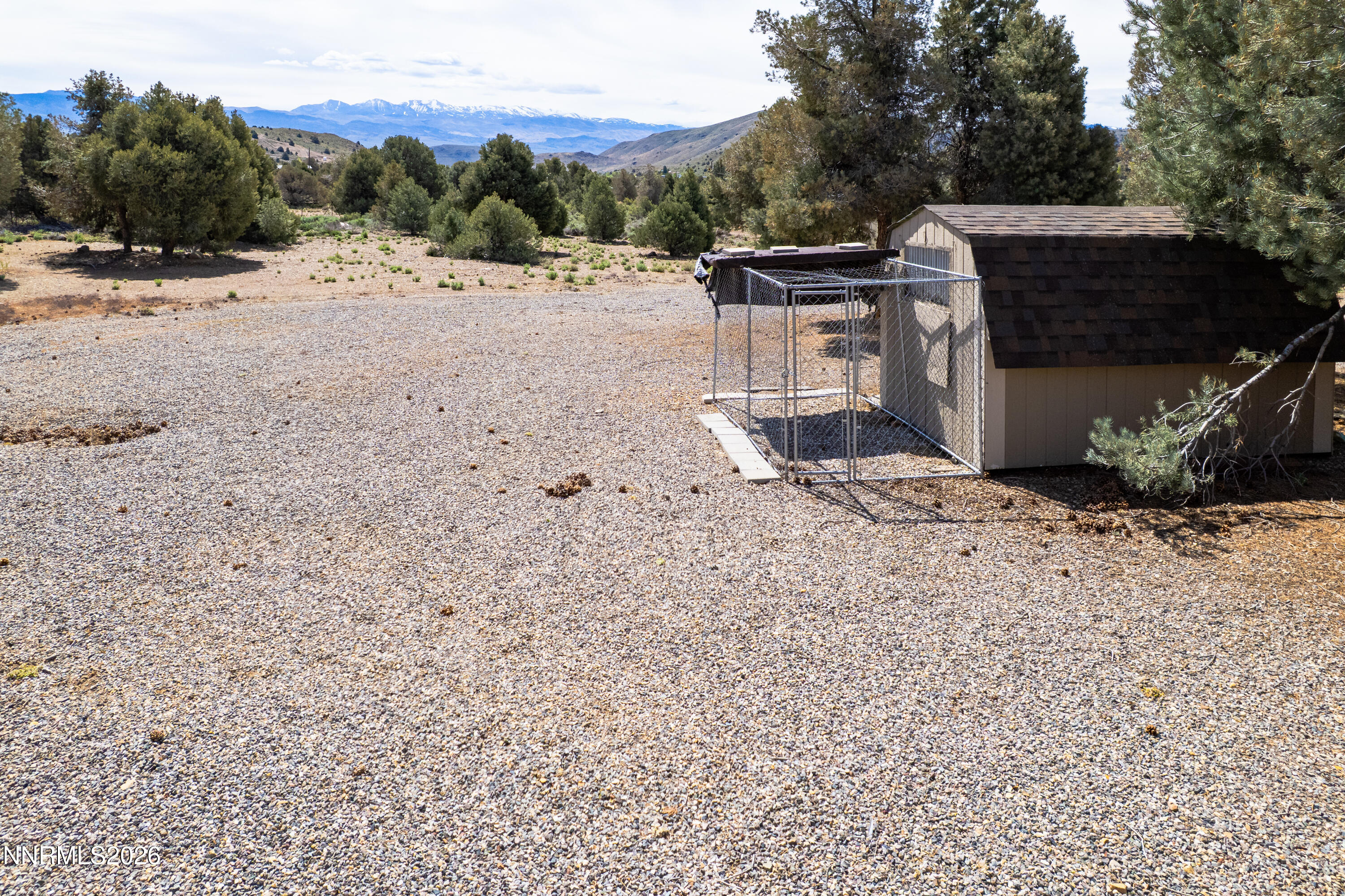 1355 Sandstone Drive Topaz Ranch Estates, NV 89444 - Photo 46 of 57 a view of a backyard with wooden fence