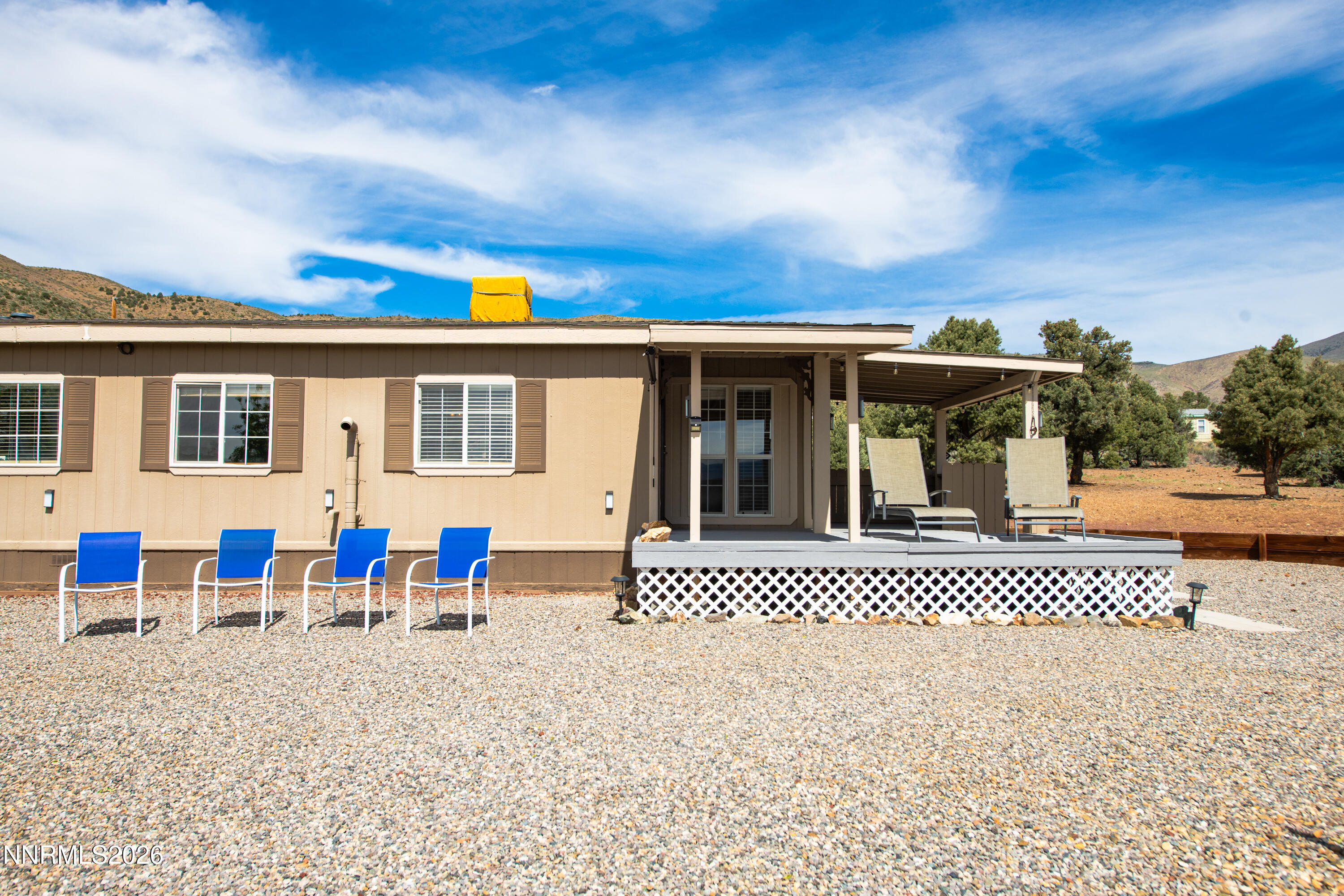 1355 Sandstone Drive Topaz Ranch Estates, NV 89444 - Photo 48 of 57 a view of a house with wooden deck and furniture