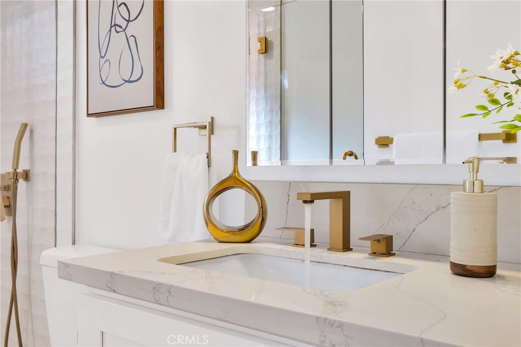 26700 Indian Peak Road Rancho Palos Verdes, CA 90275 - Photo 14 of 40 a bathroom with a granite countertop sink and a mirror