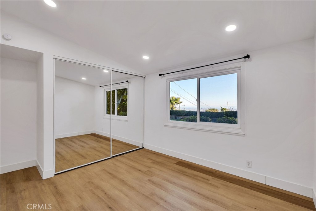 26700 Indian Peak Road Rancho Palos Verdes, CA 90275 - Photo 15 of 40 a view of empty room with wooden floor and fan