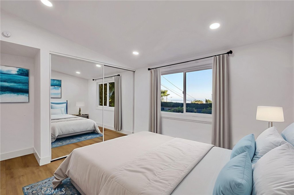 26700 Indian Peak Road Rancho Palos Verdes, CA 90275 - Photo 19 of 40 a bedroom with a large bed and a large window
