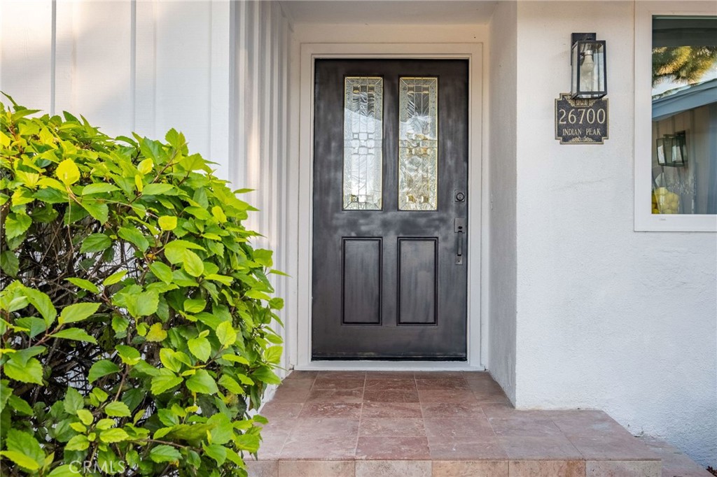 26700 Indian Peak Road Rancho Palos Verdes, CA 90275 - Photo 34 of 40 a view of front door with a potted plant