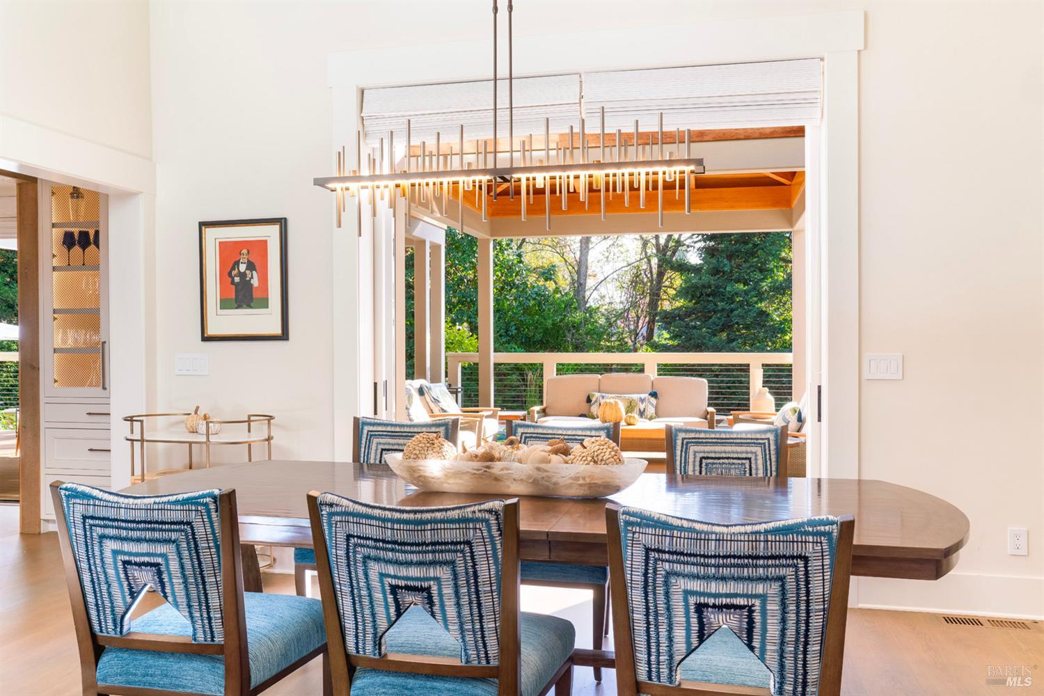 1711 Spring Street St. Helena, CA 94574 - Photo 13 of 38 a dining room with furniture a window and a chandelier