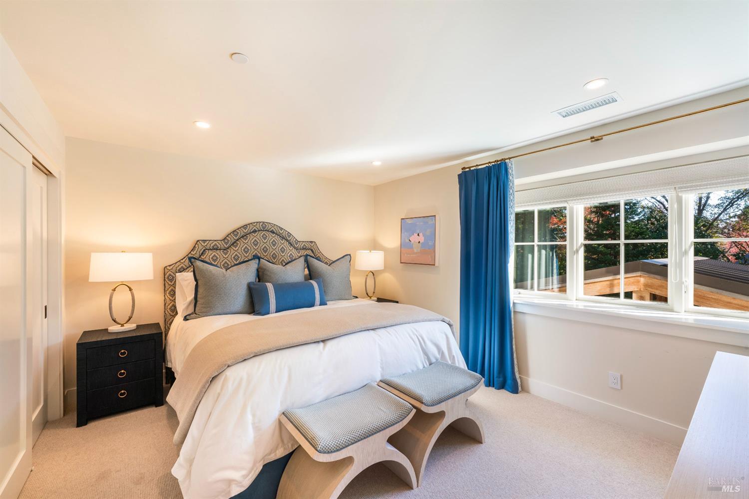 1711 Spring Street St. Helena, CA 94574 - Photo 28 of 38 a bedroom with a bed and a large window