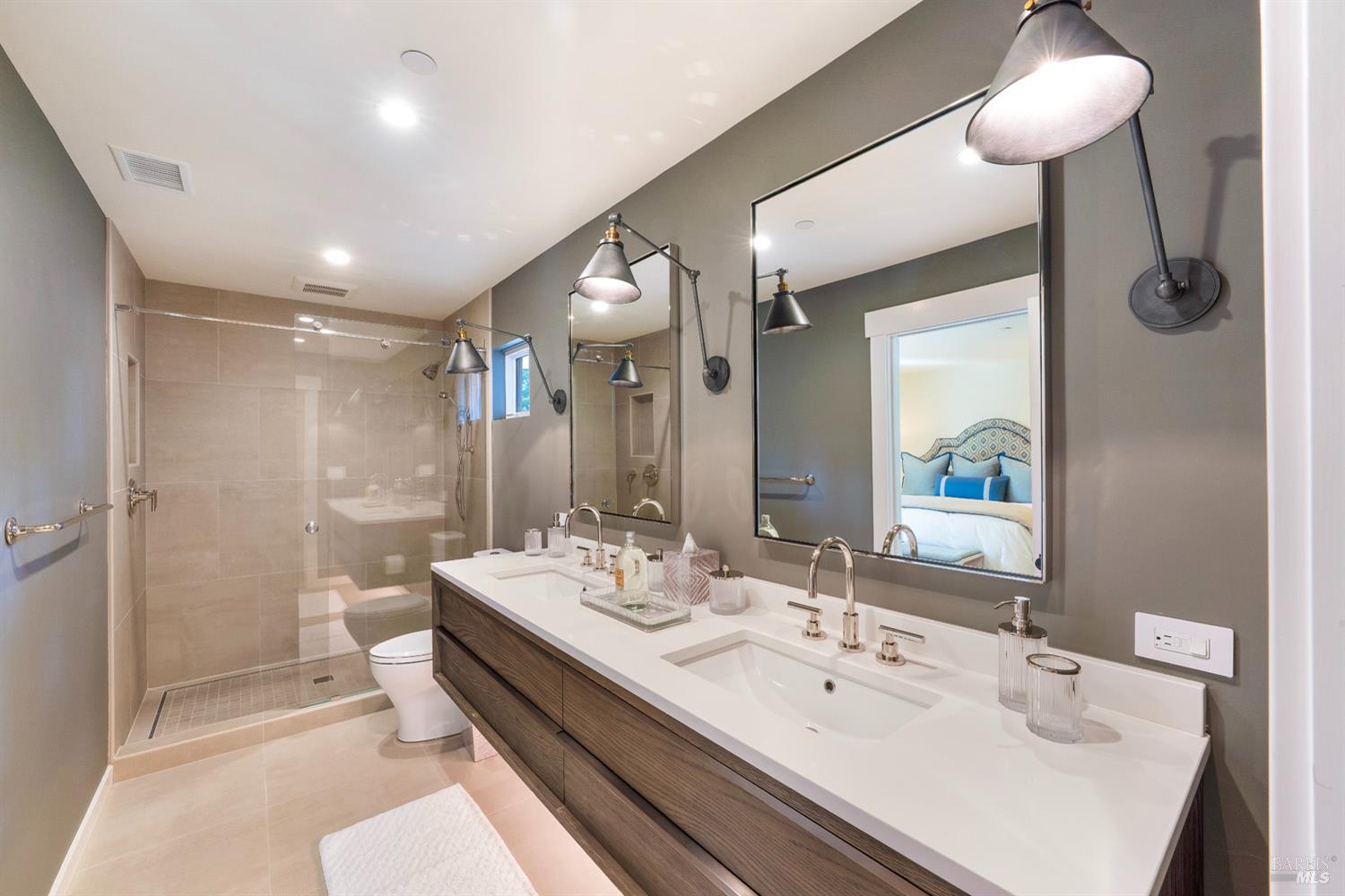 1711 Spring Street St. Helena, CA 94574 - Photo 30 of 38 a bathroom with a double vanity sink mirror and shower