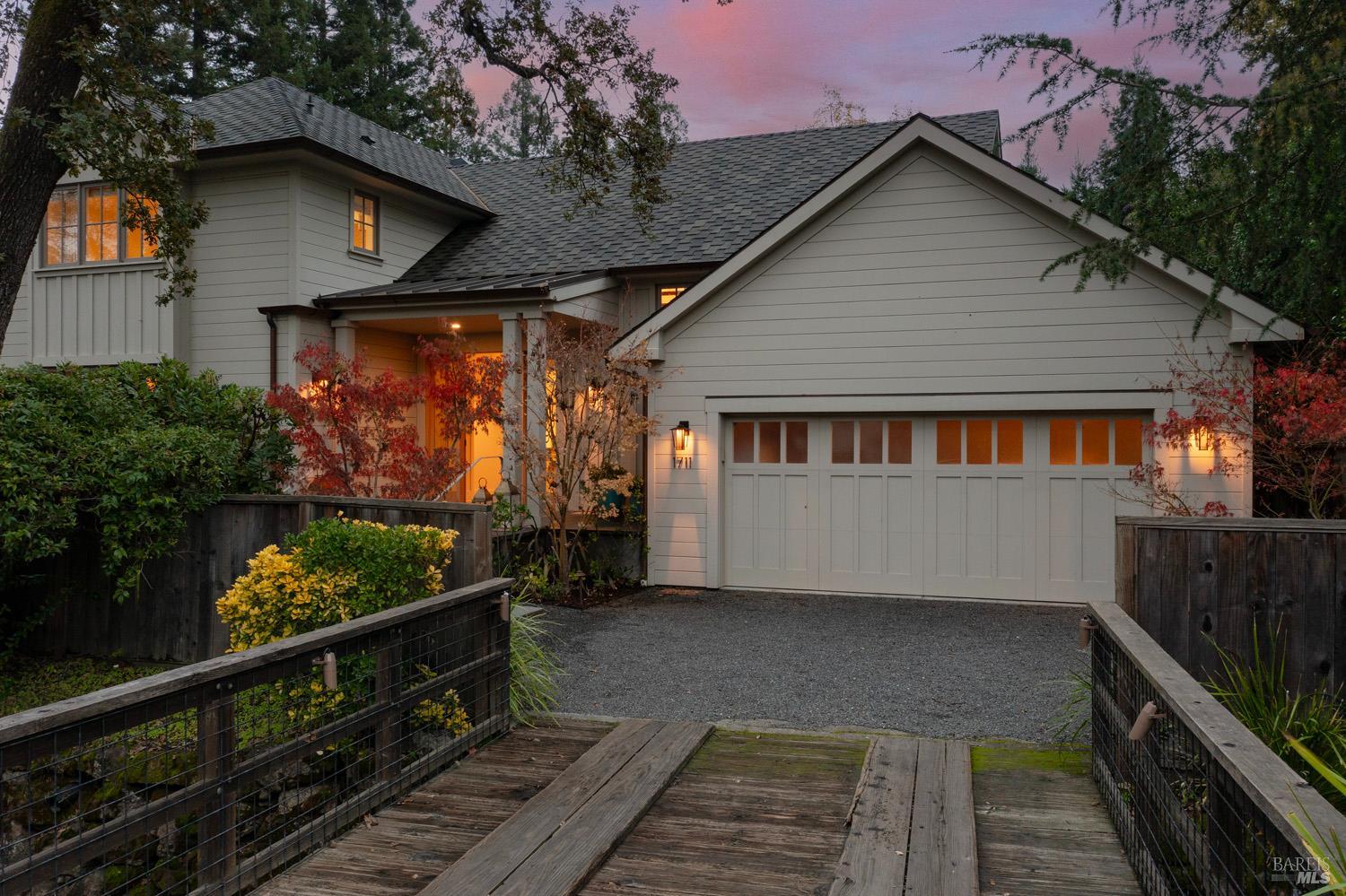 1711 Spring Street St. Helena, CA 94574 - Photo 35 of 38 a view of a white house with a small yard and wooden fence