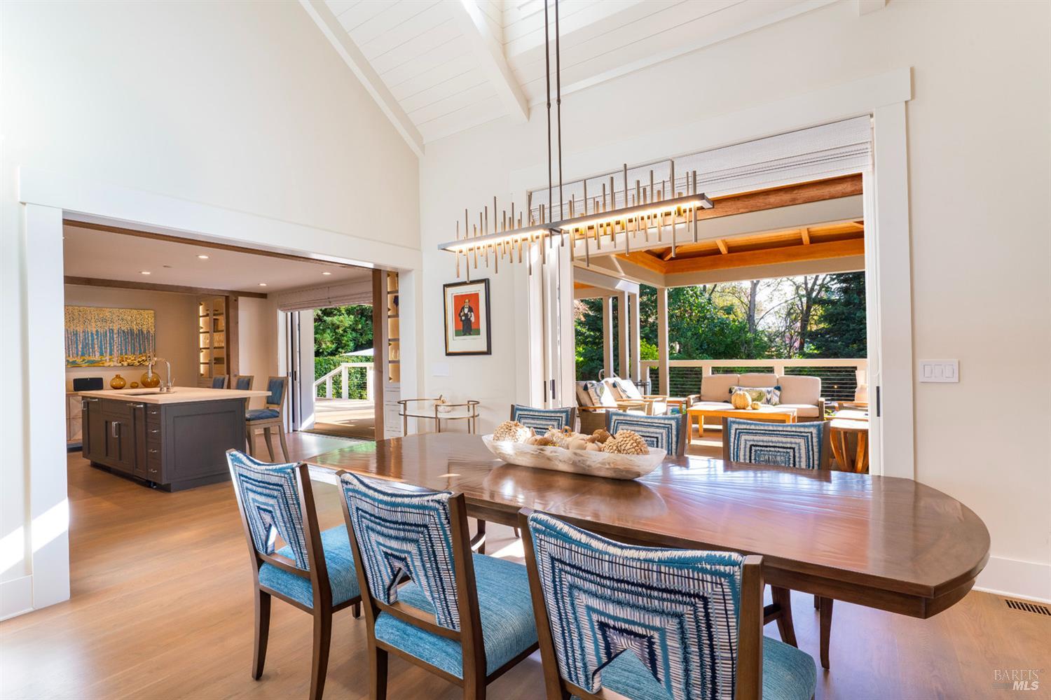 1711 Spring Street St. Helena, CA 94574 - Photo 8 of 38 a dining room with furniture a chandelier and wooden floor