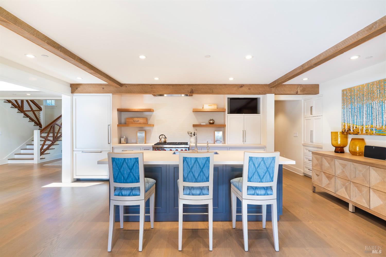 1711 Spring Street St. Helena, CA 94574 - Photo 10 of 38 a kitchen with a dining table chairs wooden floor and stainless steel appliances