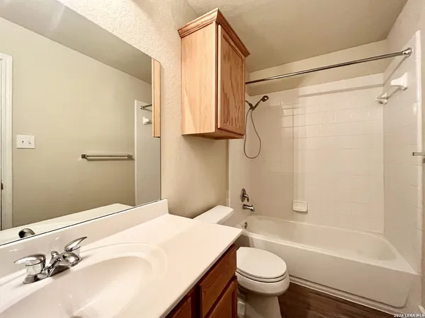 a bathroom with a sink a toilet and a bathtub