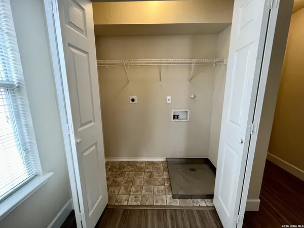 a bathroom with a tub and a window
