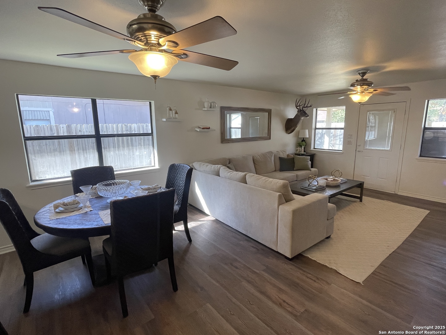 1408 33rd Street Hondo, TX 78861 - Photo 11 of 19 a living room with furniture a chandelier and a table