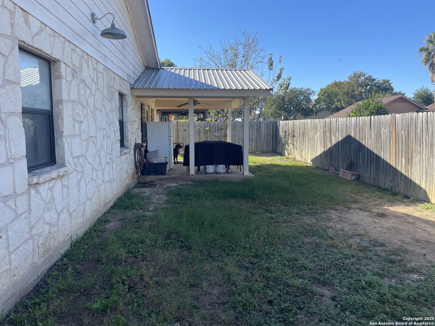 1408 33rd Street Hondo, TX 78861 - Photo 19 of 19 a view of a house with backyard and sitting area