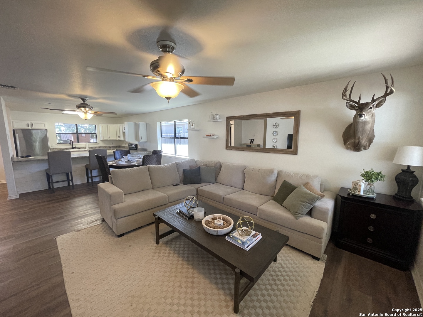 1408 33rd Street Hondo, TX 78861 - Photo 9 of 19 a living room with furniture a chandelier and a rug