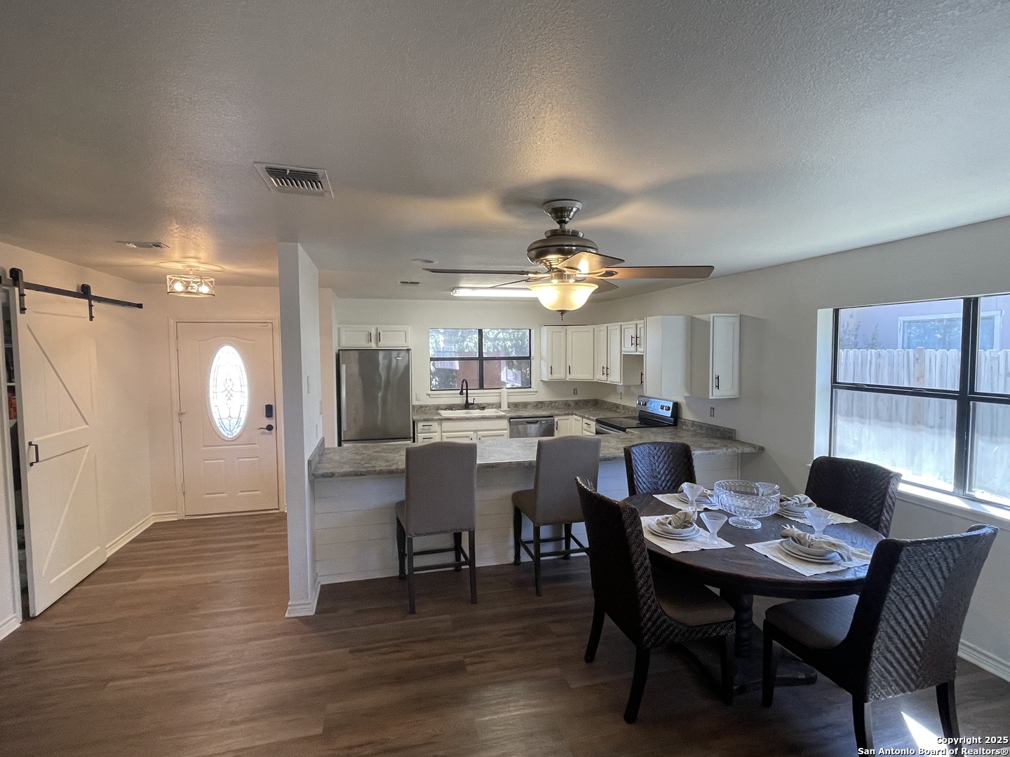 1408 33rd Street Hondo, TX 78861 - Photo 10 of 19 a view of a dining room with furniture and chandelier