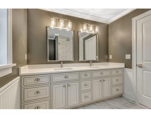 7 Tremlett Road Billerica, MA 01821 - Photo 19 of 30 a bathroom with a granite countertop double vanity sink and mirror