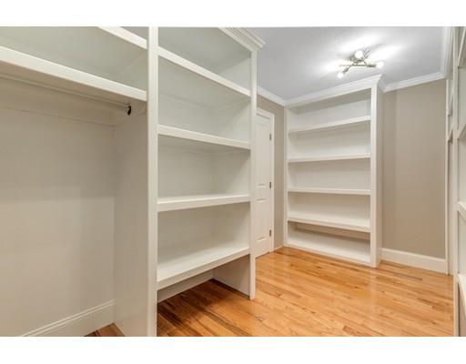 7 Tremlett Road Billerica, MA 01821 - Photo 21 of 30 a room with wooden floor and lots of cabinets