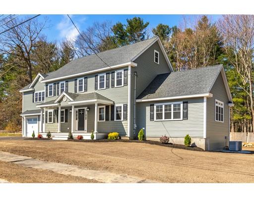 7 Tremlett Road Billerica, MA 01821 - Photo 3 of 30 a front view of a house with a yard