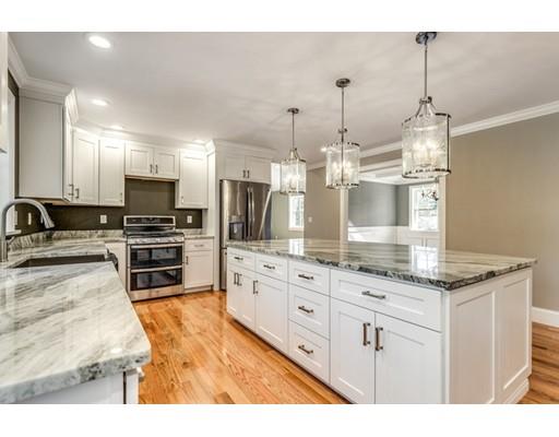 7 Tremlett Road Billerica, MA 01821 - Photo 6 of 30 a kitchen with granite countertop a sink stainless steel appliances and cabinets