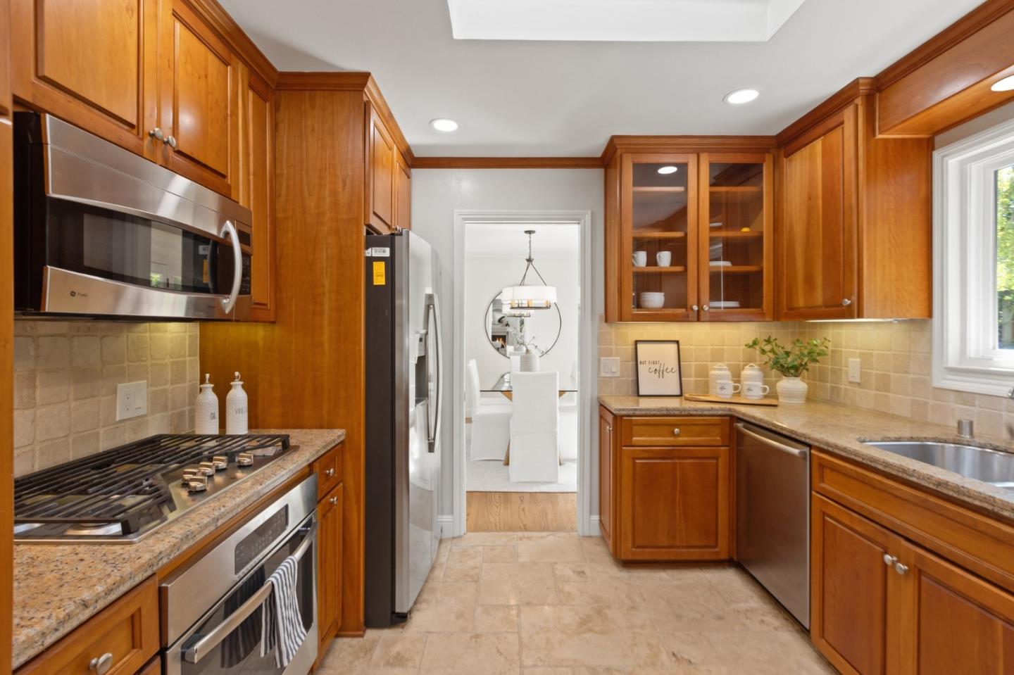143 Waverly Place Mountain View, CA 94040 - Photo 21 of 52 a kitchen with stainless steel appliances granite countertop a stove and a sink