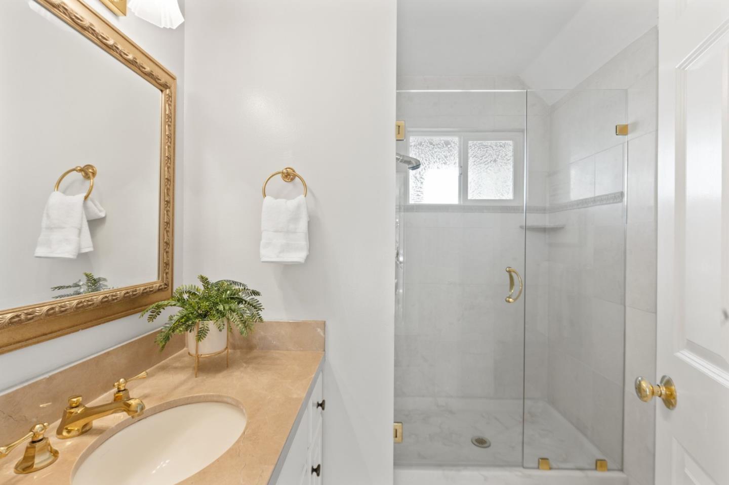 143 Waverly Place Mountain View, CA 94040 - Photo 25 of 52 a bathroom with a granite countertop sink a mirror and a shower
