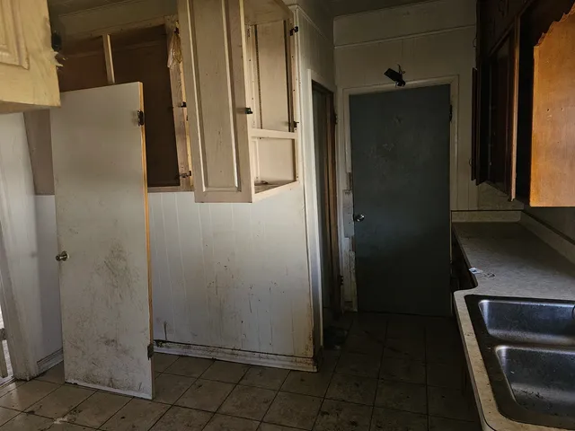 a bathroom with a shower and a sink