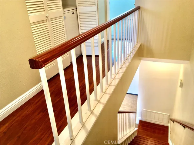 a view of hallway with wooden floor