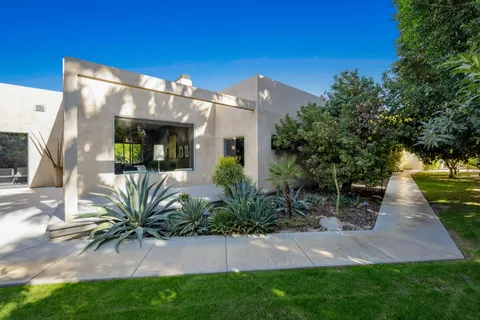 a kitchen with stainless steel appliances a sink stove and cabinets