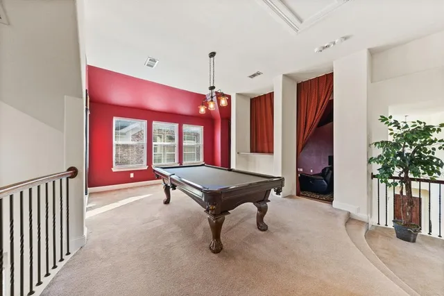 a bedroom with furniture and window