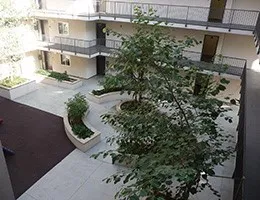 an aerial view of a house with a yard and garden