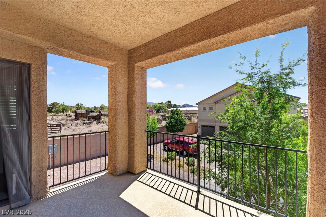 1824 Redland Ridge Street Henderson, NV 89002 - Photo 35 of 69 Enjoy the elevated outdoor area with an open railing and expansive desert landscape views.