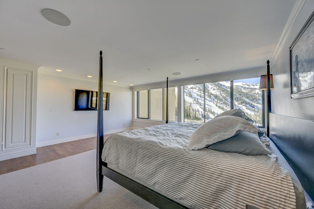 9699 Bypass Road, Unit 5 Alta, UT 84092 - Photo 2 of 54 Floor-to-ceiling windows with mountain scenery, recessed lighting, built-in ceiling speakers, crown molding, and two-tone wall finishes