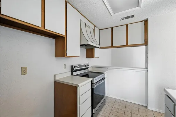 a view of wooden floor and windows in a kitchen