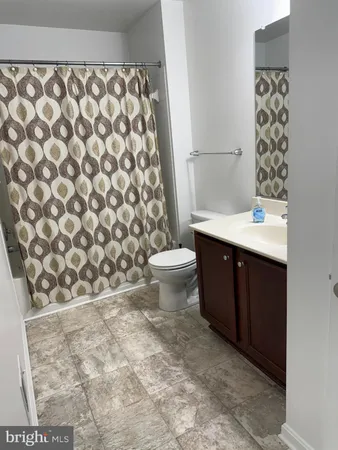 a bathroom with a bathtub and shower