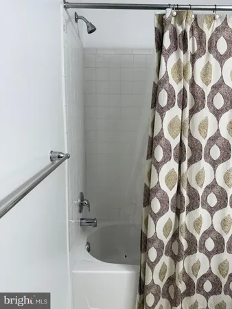 a room with a cabinets and rug