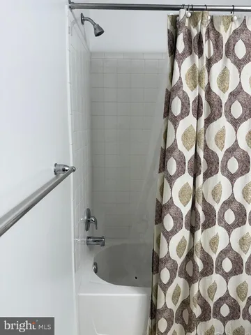 a room with a cabinets and rug