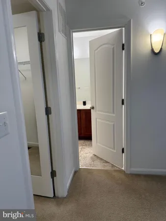 a bathroom with a double vanity sink toilet mirror and shower