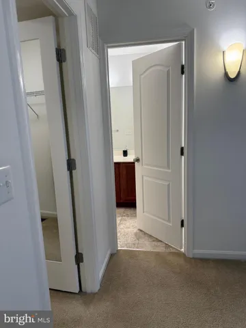 a bathroom with a double vanity sink toilet mirror and shower