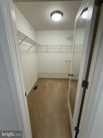 a bathroom with a shower a toilet and a sink