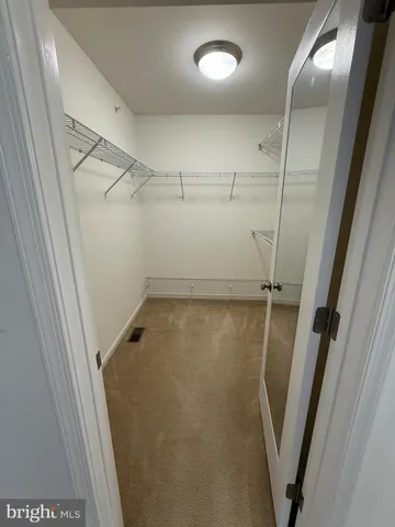 a bathroom with a shower a toilet and a sink