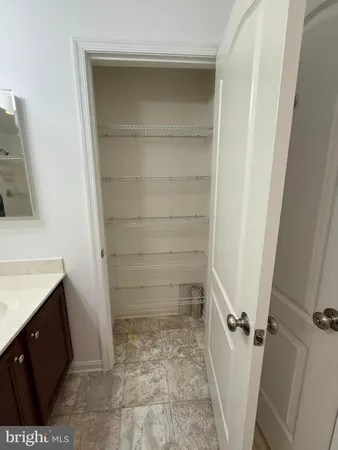 a room with a bed and window