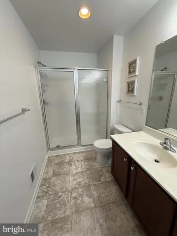 a bedroom with two beds and window