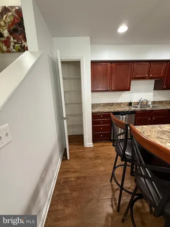 a kitchen with a table and chairs in it